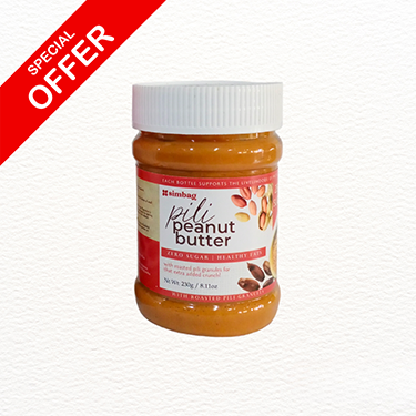 Simbag sugar-free peanut butter with pili chunks in a sealed jar with red lid